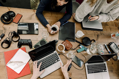 High angle view of female coworkers working in office