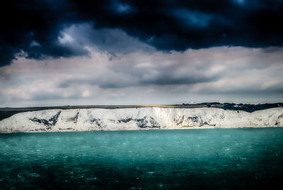 Scenic view of sea against sky during winter