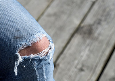 Cropped image of person wearing tone jeans