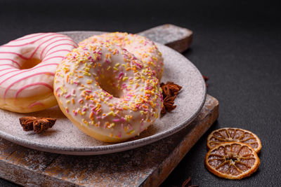 Close-up of donuts in plate on table