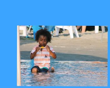 Portrait of boy in swimming pool