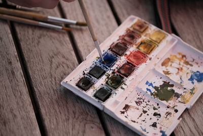 High angle view of paintbrushes on table