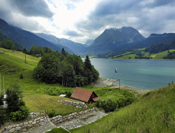 Scenic view of lake and mountains against sky