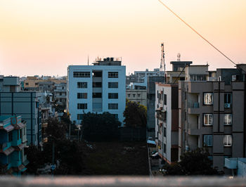Buildings against sky during sunset