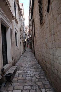 Narrow alley along buildings