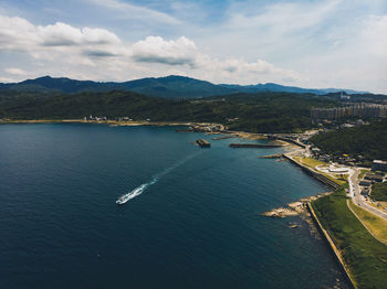 Beautiful coast with ship from high angle view of drone shot