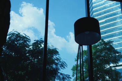 Low angle view of silhouette trees against sky