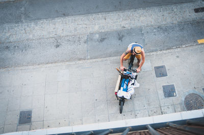 High angle view of man on bicycle at footpath