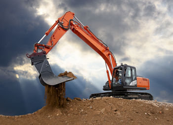 Excavator works in construction site