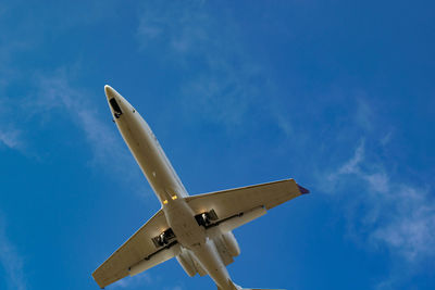 Low angle view of airplane against sky