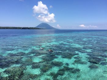 Scenic view of sea against blue sky