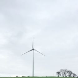 Low angle view of wind turbine against sky