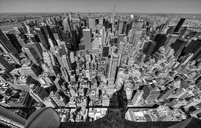 High angle view of city buildings against sky