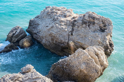 High angle view of rock formation in sea