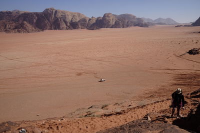 Woman walking in desert