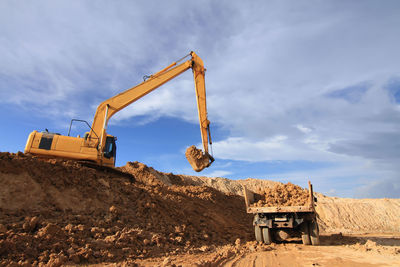 Construction site on field against sky