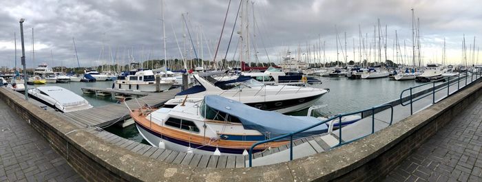 Boats moored at harbor