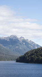 Scenic view of sea and mountains against sky
