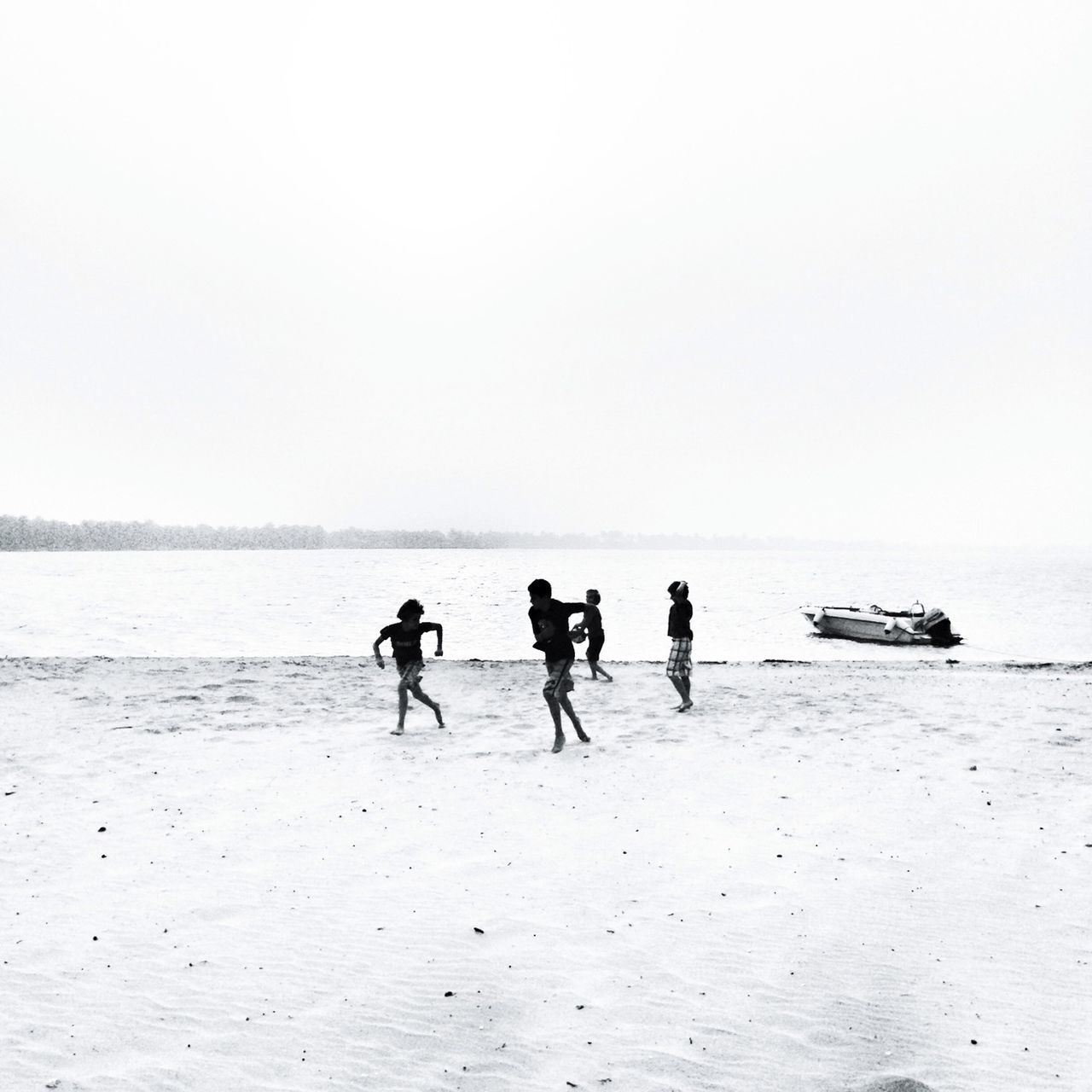 water, sea, beach, clear sky, copy space, leisure activity, shore, lifestyles, horizon over water, men, sand, togetherness, tranquility, vacations, nautical vessel, tranquil scene, nature, beauty in nature