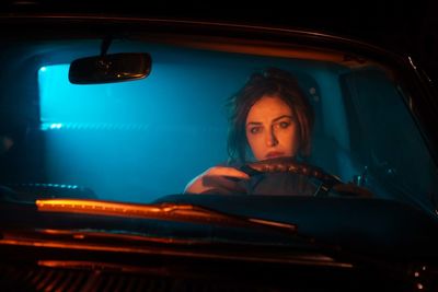 Portrait of woman sitting in car