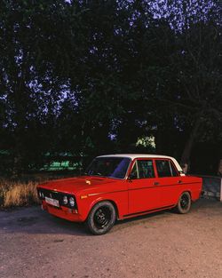 Red vintage car on street