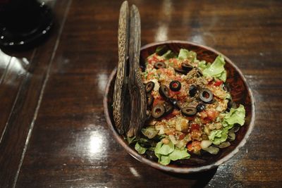 High angle view of salad in bowl on table