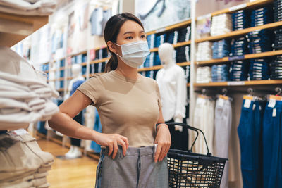 Portrait of woman standing in store