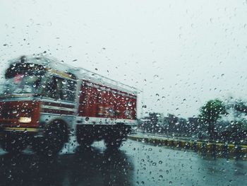 Truck seen from wet window