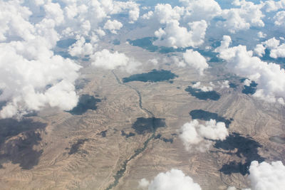 Scenic view of mountains against cloudy sky