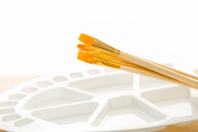 Close-up of dentures against white background