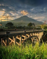 Beautiful view of the sigandul bridge with a cleft mountain in the background in temanggung