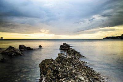 Scenic view of sea against sky during sunset