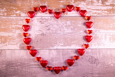 Directly above shot of heart shape on red background