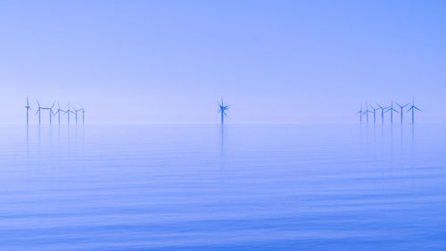 Offshore wind turbines generating renewable electricity and energy 