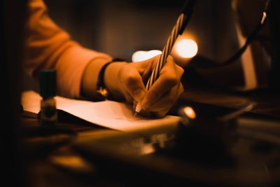 Close-up of hand holding paper