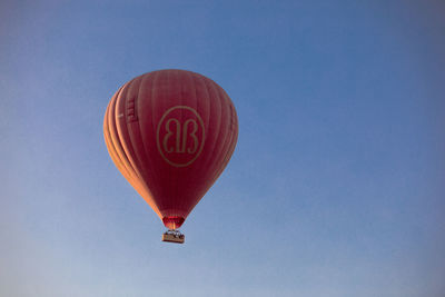 Low angle view of hot air balloon against clear sky