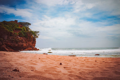 Scenic view of beach against sky