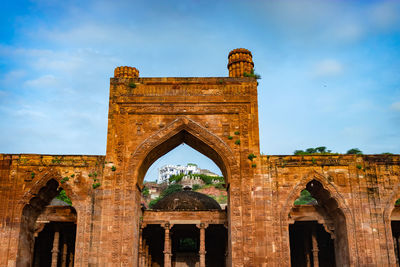 Ancient grand mosque called adhai din ka jhonpra vintage architecture with bright blue sky 