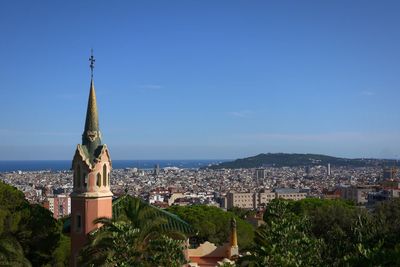 Cityscape against clear blue sky