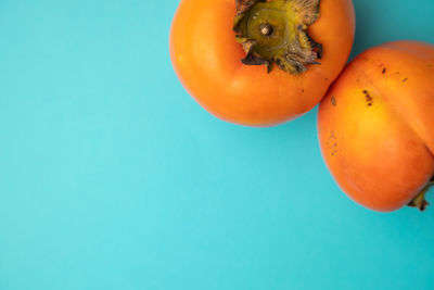 Close-up of orange against blue background