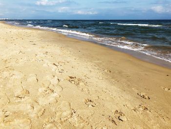 Scenic view of beach against sky