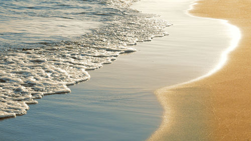 High angle view of surf on beach