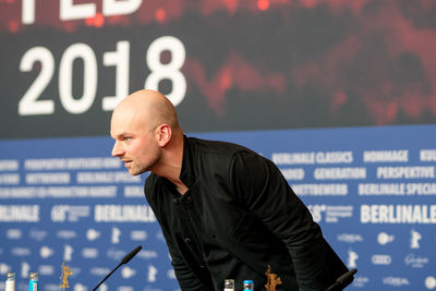 Man standing against blurred background