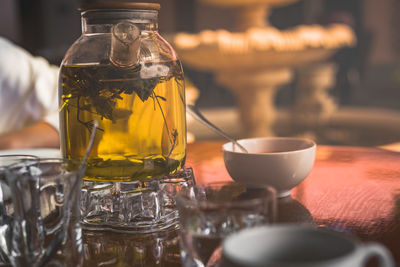 Close-up of tea in glass jar on table