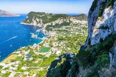 Scenic view of sea and mountains against sky