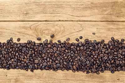Directly above shot of roasted coffee beans on table