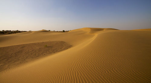 Scenic view of desert against clear sky