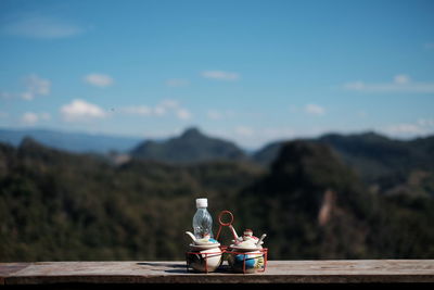 Fire hydrant on table against mountains