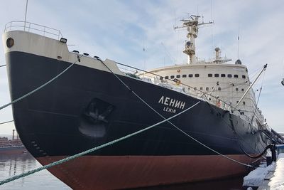 Ship moored on sea against sky