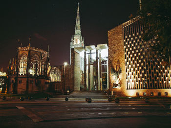 Illuminated buildings in city at night